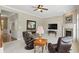 Inviting living room with fireplace, plush seating, and neutral decor, perfect for relaxation and entertaining at 16802 Oak Manor Dr, Westfield, IN 46074