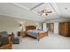 Large main bedroom featuring neutral walls, carpet flooring, and ceiling fan with natural light at 16802 Oak Manor Dr, Westfield, IN 46074