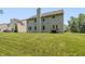 Exterior shot of the home with a large grassy backyard perfect for outdoor activities at 1696 Woodfield Dr, Greenwood, IN 46143