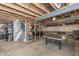 Spacious unfinished basement with stairs, game area, and abundant space for various activities at 1696 Woodfield Dr, Greenwood, IN 46143