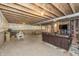 Unfinished basement with exposed ceiling, ping pong table, and ample space for customization at 1696 Woodfield Dr, Greenwood, IN 46143