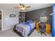 Stylish bedroom with a unique accent wall, fan, and desk at 1696 Woodfield Dr, Greenwood, IN 46143