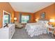 Cozy bedroom with a plush armchair, white dresser, and a comfortable bed at 1696 Woodfield Dr, Greenwood, IN 46143