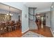Inviting foyer with hardwood floors and staircase at 1696 Woodfield Dr, Greenwood, IN 46143