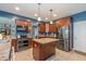 Updated kitchen with stainless steel appliances and a convenient center island at 1696 Woodfield Dr, Greenwood, IN 46143