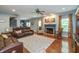 Cozy living room with a fireplace, hardwood floors, and ample natural light at 1696 Woodfield Dr, Greenwood, IN 46143