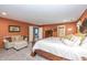 Spacious main bedroom suite featuring a sitting area and luxurious king bed at 1696 Woodfield Dr, Greenwood, IN 46143