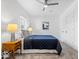 Bedroom featuring a comfortable bed with blue quilt and stylish ceiling fan at 1709 Fletcher Ave, Indianapolis, IN 46203