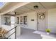 Inviting front porch featuring a wreath, a ceiling fan and beautiful brick support at 1709 Fletcher Ave, Indianapolis, IN 46203