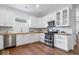 Modern kitchen featuring stainless steel appliances, wooden countertop and white cabinets at 1709 Fletcher Ave, Indianapolis, IN 46203