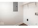 Bright laundry area with wood floors, utility connections, and functional shelving at 1709 Fletcher Ave, Indianapolis, IN 46203