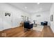 Bright living room with new floors, recessed lighting and stylish furniture at 1709 Fletcher Ave, Indianapolis, IN 46203