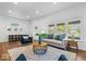 Bright living room with new floors, recessed lighting and stylish furniture at 1709 Fletcher Ave, Indianapolis, IN 46203