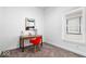 Bright office with modern decor including a desk, red chair, and abstract art at 1709 Fletcher Ave, Indianapolis, IN 46203