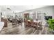 Well-lit dining area flows into a comfortable living room with updated flooring and stylish decor at 17309 Graley Pl, Westfield, IN 46074