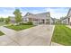 Attractive home showcasing a well-kept lawn, driveway, landscaping and charming covered front porch seating at 17309 Graley Pl, Westfield, IN 46074