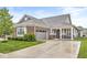 Charming brick home with a well-maintained lawn, attached garage, and inviting front porch at 17309 Graley Pl, Westfield, IN 46074