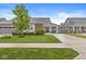 Beautiful home featuring a well-manicured lawn, mature tree, and charming covered front porch seating at 17309 Graley Pl, Westfield, IN 46074