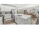 Modern kitchen boasts a large island, stainless steel appliances, and seamless flow into living spaces at 17309 Graley Pl, Westfield, IN 46074
