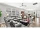Bright living room with large windows, comfortable seating, and ceiling fan for a cozy and inviting atmosphere at 17309 Graley Pl, Westfield, IN 46074