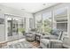 Relaxing living room featuring a sliding glass door to patio and comfortable seating with plenty of natural light at 17309 Graley Pl, Westfield, IN 46074