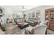 Cozy living room featuring plush seating, a ceiling fan, and large windows for natural light at 17309 Graley Pl, Westfield, IN 46074