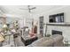 Open-concept living space with a fireplace, neutral color palette, and plenty of natural light creating an inviting atmosphere at 17309 Graley Pl, Westfield, IN 46074