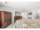 Main bedroom with neutral colors, large dresser, closet, and open doorway creating a spacious and serene escape at 17309 Graley Pl, Westfield, IN 46074