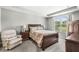 Comfortable main bedroom with large window, neutral colors, and coordinated furniture creating a relaxing retreat at 17309 Graley Pl, Westfield, IN 46074