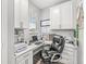 This office includes lots of workspace, natural light, and built-in cabinets for organization at 17309 Graley Pl, Westfield, IN 46074