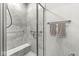 Tiled stand-up shower with built-in bench and sleek fixtures create a spa-like retreat at 17309 Graley Pl, Westfield, IN 46074