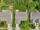 An aerial view of the house showcasing the roof, backyard, and a white car parked in the driveway at 17357 Austrian Pine Way, Westfield, IN 46074