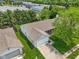 An aerial view of the house showcasing the roof and well maintained front lawn, and large commercial buildings nearby at 17357 Austrian Pine Way, Westfield, IN 46074
