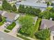 An aerial view of the house in a neighborhood showcasing the roof and front lawn, and large commercial buildings nearby at 17357 Austrian Pine Way, Westfield, IN 46074