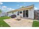 Backyard patio complete with a barbecue grill and a modern fire pit table at 17357 Austrian Pine Way, Westfield, IN 46074