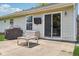 Backyard patio with fire pit, grill, and sliding glass door access to the home at 17357 Austrian Pine Way, Westfield, IN 46074