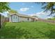 The backyard has a storage shed and the yard is surrounded by a wooden fence at 17357 Austrian Pine Way, Westfield, IN 46074