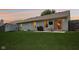 Backyard with a spacious lawn, patio, and a privacy fence at 17357 Austrian Pine Way, Westfield, IN 46074