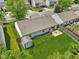 Aerial view of the backyard with a lush lawn, patio, storage shed, and wood fence at 17357 Austrian Pine Way, Westfield, IN 46074