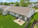 Aerial view of a well-maintained backyard featuring a lawn, patio with furniture, and storage shed at 17357 Austrian Pine Way, Westfield, IN 46074