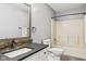 Neutral bathroom featuring a vanity with dark countertop and a bathtub shower combination at 17357 Austrian Pine Way, Westfield, IN 46074