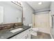 Neutral bathroom featuring a vanity with dark countertop and a bathtub shower combination at 17357 Austrian Pine Way, Westfield, IN 46074