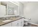 Bathroom boasts double sinks, granite countertops, decorative mirror, and a modern toilet at 17357 Austrian Pine Way, Westfield, IN 46074