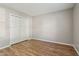 This bedroom has hardwood floors, neutral colored walls and a closet at 17357 Austrian Pine Way, Westfield, IN 46074