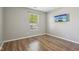 Bedroom features a hardwood floor, neutral colored walls, a TV and a window at 17357 Austrian Pine Way, Westfield, IN 46074