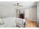 Bedroom showcases wood floors, a dresser with a TV, and access to the bathroom at 17357 Austrian Pine Way, Westfield, IN 46074