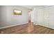 Bedroom features a hardwood floor, neutral colored walls, a TV and a closet at 17357 Austrian Pine Way, Westfield, IN 46074