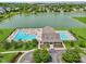 Aerial view of community pool area with dual swimming pools, clubhouse, and sunbathing area at 17357 Austrian Pine Way, Westfield, IN 46074
