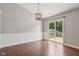 Bright dining room with wood floors and sliding glass doors to the backyard patio at 17357 Austrian Pine Way, Westfield, IN 46074