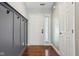 Inviting entryway with gray wainscoting and hooks for coats or bags at 17357 Austrian Pine Way, Westfield, IN 46074